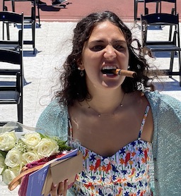 becky graduation with cigar and flowers